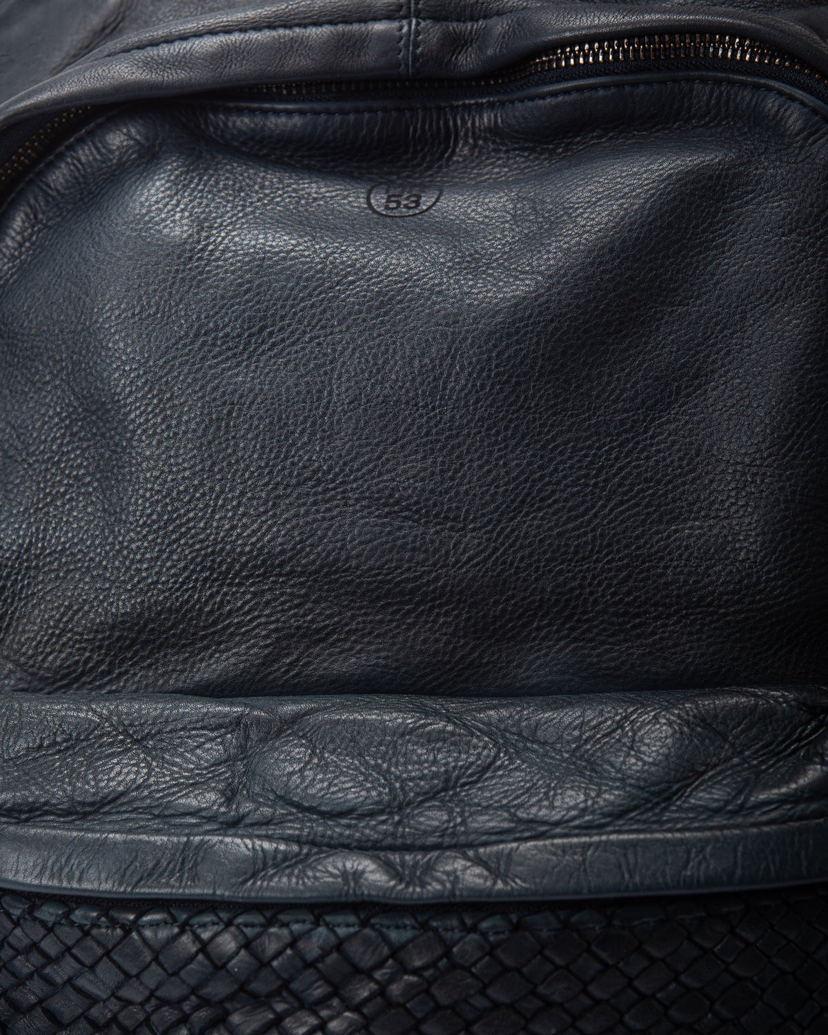 Clusone men's leather backpack with woven pocket